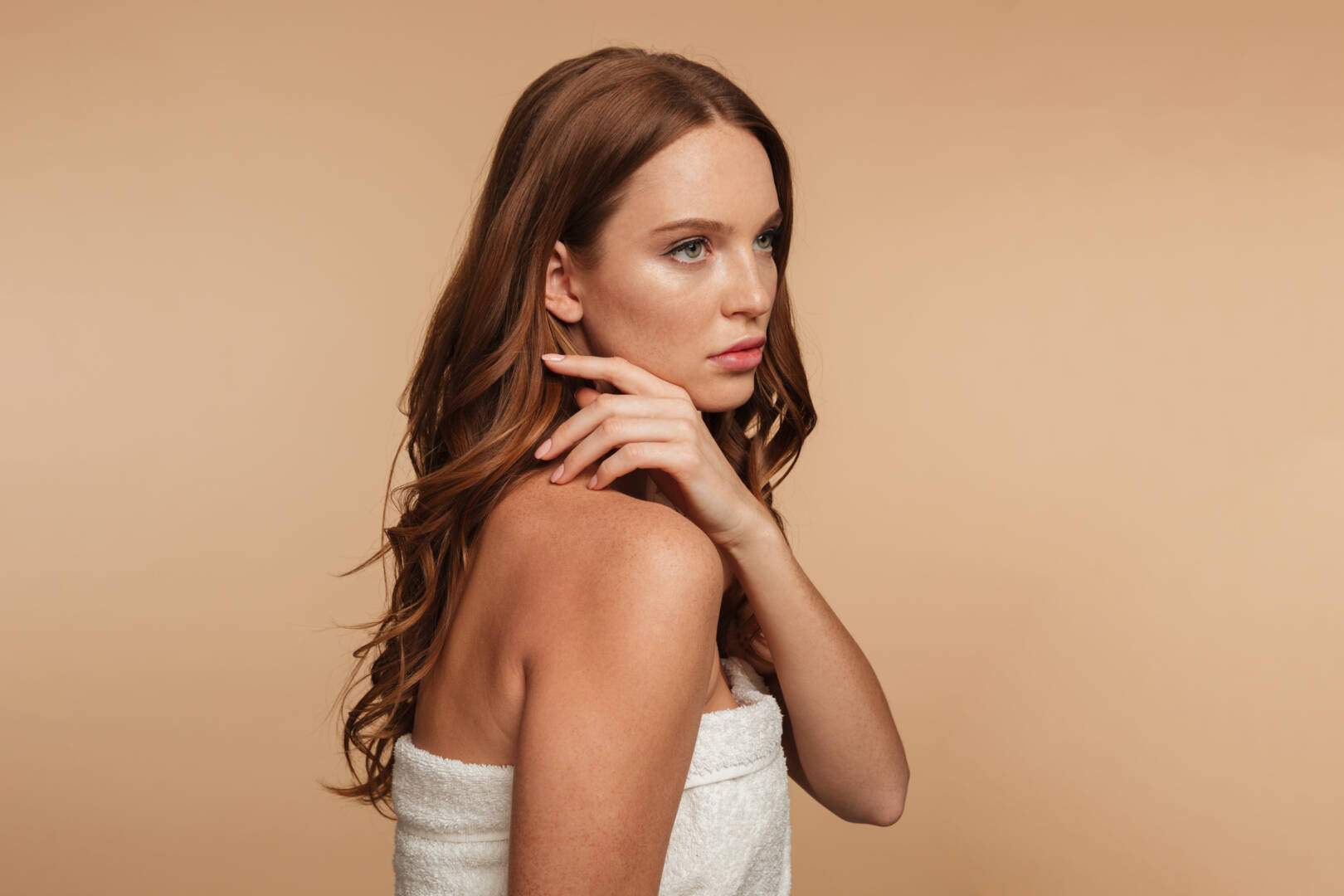 Beauty portrait of mystery ginger woman with long hair